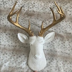 Gold and white deer head.